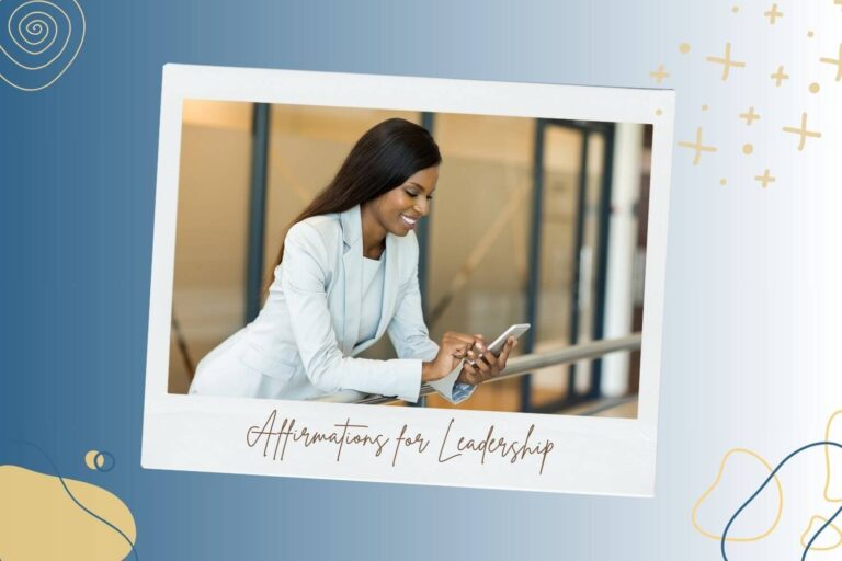 A confident woman in a light blue suit smiles while looking at her smartphone, standing in a modern office environment. The image is bordered by abstract shapes and patterns, with the phrase "Affirmations for Leadership" written in cursive underneath.