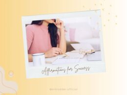 A close-up of a woman in a pink sweater, deep in thought, as she writes in a notebook on a desk filled with papers and a coffee mug. The background is framed with light-colored abstract designs, and the text "Affirmations for Success" is shown at the bottom in elegant cursive.